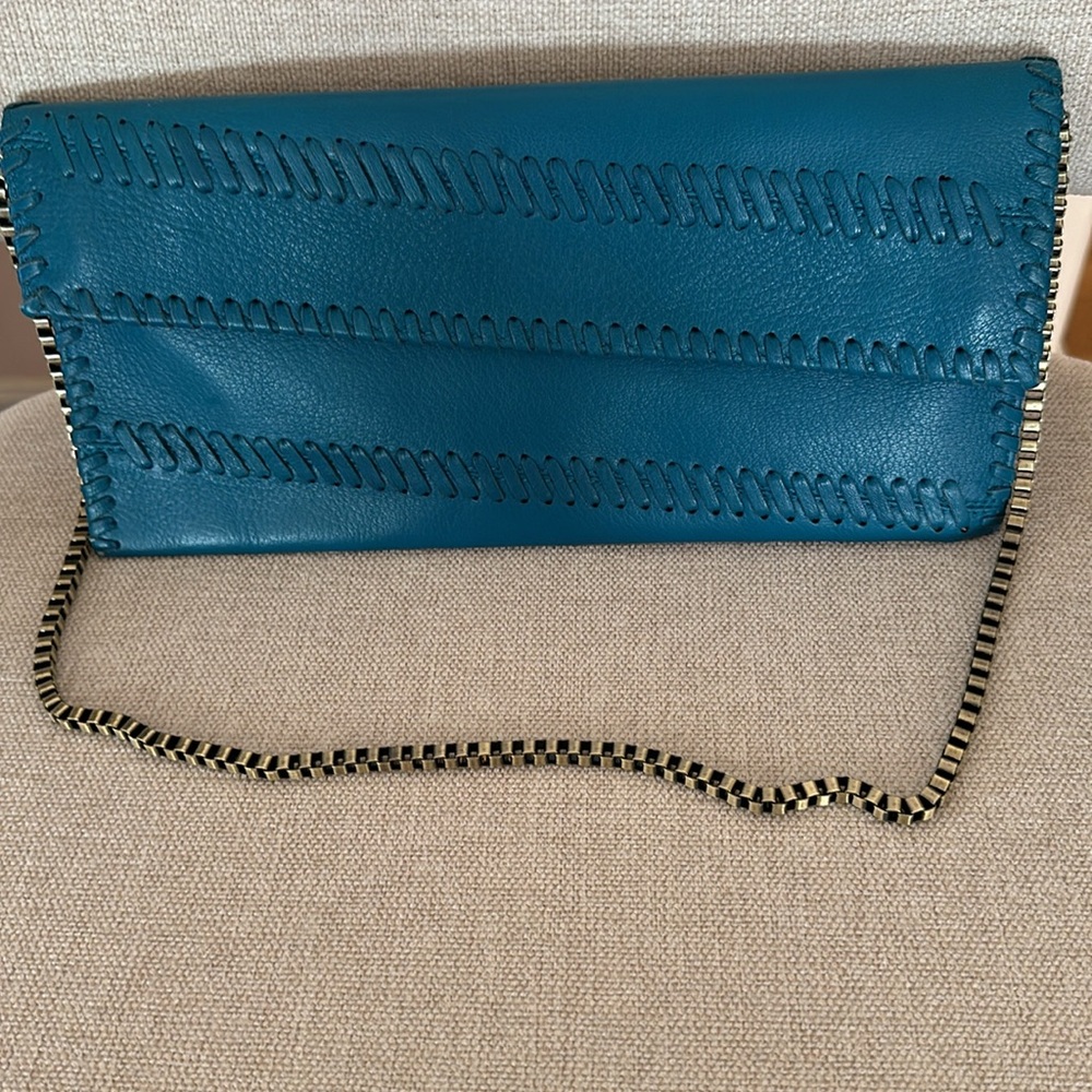 Carlos Falchi leather turquoise clutch. Used only once.